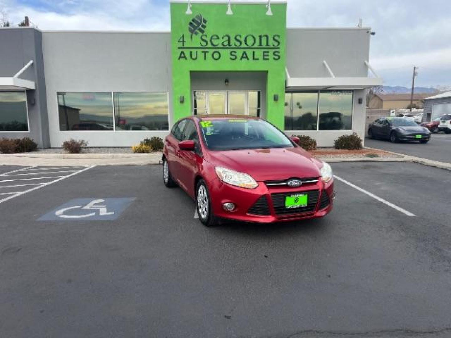 2012 Race Red /Charcoal Black/Metal Gray Cloth Interior Ford Focus SE (1FAHP3K22CL) with an 2.0L L4 DOHC 16V engine, located at 1865 East Red Hills Pkwy, St. George, 84770, (435) 628-0023, 37.120850, -113.543640 - Photo#0