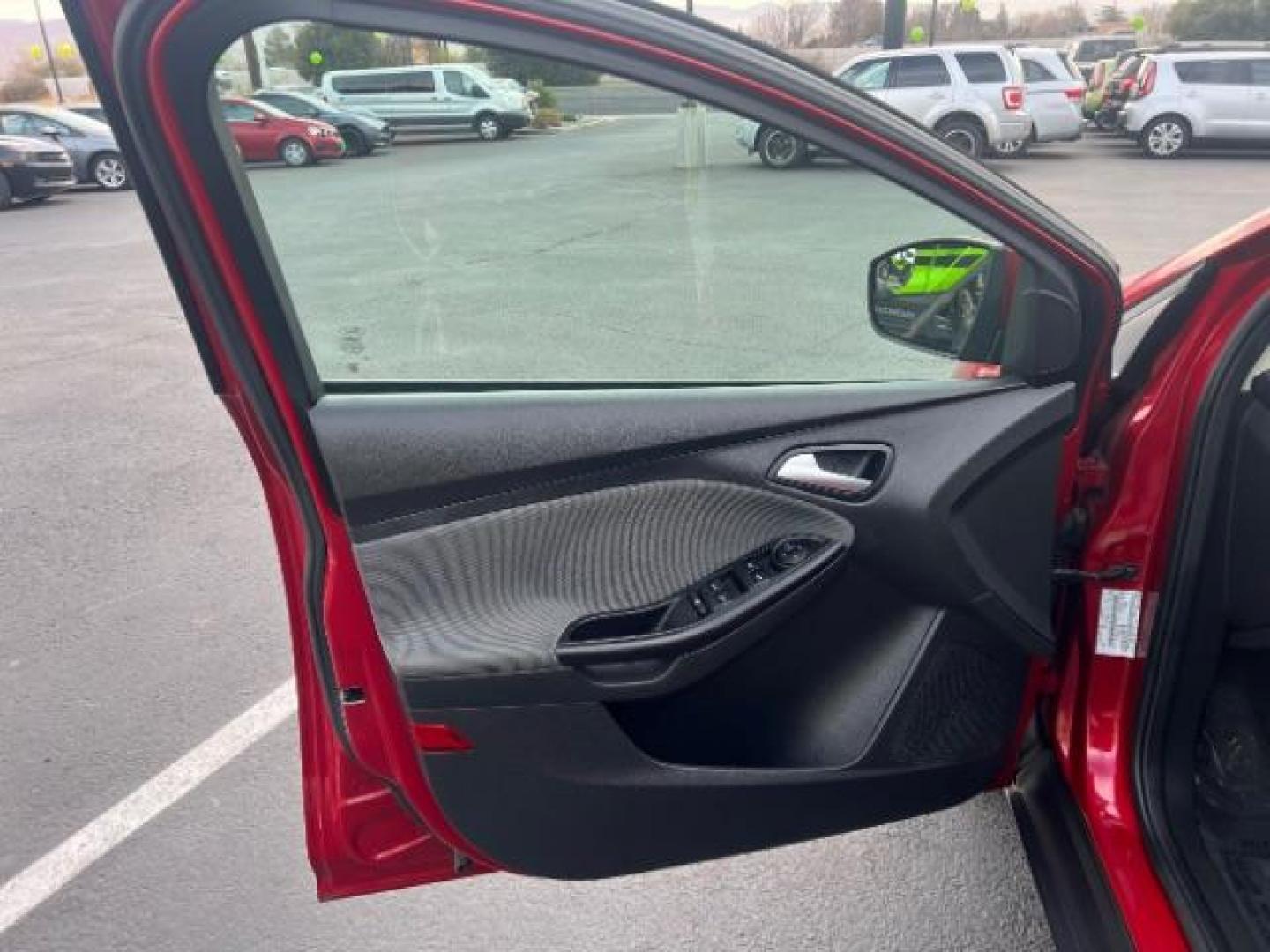 2012 Race Red /Charcoal Black/Metal Gray Cloth Interior Ford Focus SE (1FAHP3K22CL) with an 2.0L L4 DOHC 16V engine, located at 940 North Main Street, Cedar City, UT, 84720, (435) 628-0023, 37.692936, -113.061897 - We specialize in helping ALL people get the best financing available. No matter your credit score, good, bad or none we can get you an amazing rate. Had a bankruptcy, divorce, or repossessions? We give you the green light to get your credit back on the road. Low down and affordable payments that fit - Photo#13