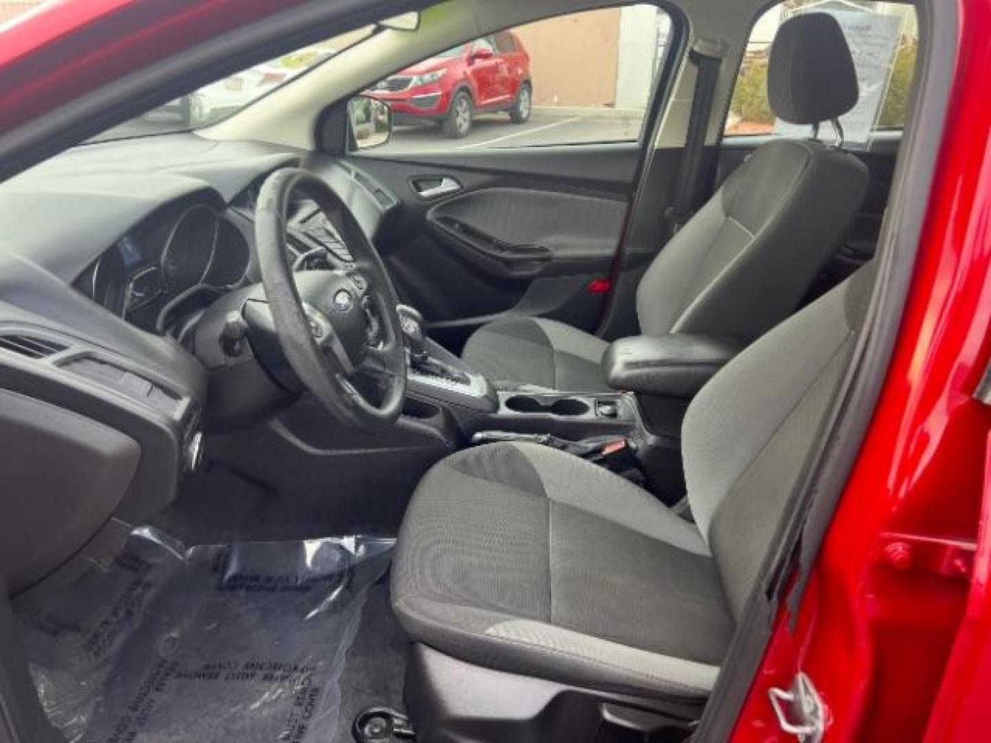 2012 Race Red /Charcoal Black/Metal Gray Cloth Interior Ford Focus SE (1FAHP3K22CL) with an 2.0L L4 DOHC 16V engine, located at 940 North Main Street, Cedar City, UT, 84720, (435) 628-0023, 37.692936, -113.061897 - We specialize in helping ALL people get the best financing available. No matter your credit score, good, bad or none we can get you an amazing rate. Had a bankruptcy, divorce, or repossessions? We give you the green light to get your credit back on the road. Low down and affordable payments that fit - Photo#14