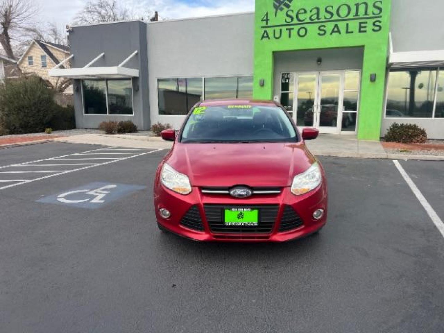 2012 Race Red /Charcoal Black/Metal Gray Cloth Interior Ford Focus SE (1FAHP3K22CL) with an 2.0L L4 DOHC 16V engine, located at 1865 East Red Hills Pkwy, St. George, 84770, (435) 628-0023, 37.120850, -113.543640 - Photo#1