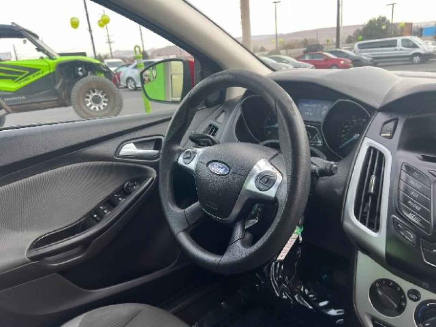 2012 Race Red /Charcoal Black/Metal Gray Cloth Interior Ford Focus SE (1FAHP3K22CL) with an 2.0L L4 DOHC 16V engine, located at 1865 East Red Hills Pkwy, St. George, 84770, (435) 628-0023, 37.120850, -113.543640 - Photo#31