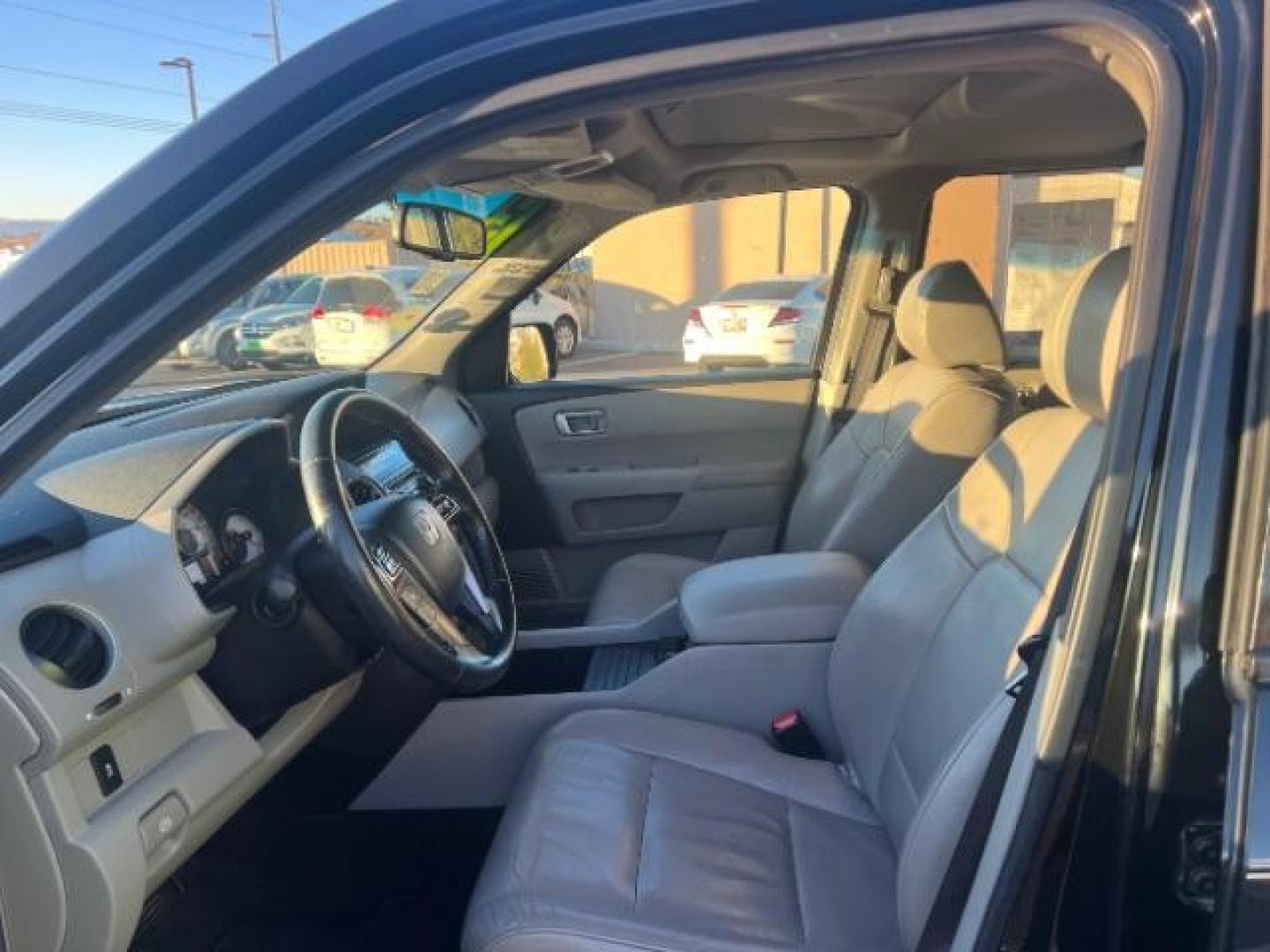 2013 Crystal Black Pearl /Beige Leather Interior Honda Pilot EX-L 4WD 5-Spd AT with Navigation (5FNYF4H79DB) with an 3.5L V6 SOHC 24V engine, 5-Speed Automatic transmission, located at 940 North Main Street, Cedar City, UT, 84720, (435) 628-0023, 37.692936, -113.061897 - We specialize in helping ALL people get the best financing available. No matter your credit score, good, bad or none we can get you an amazing rate. Had a bankruptcy, divorce, or repossessions? We give you the green light to get your credit back on the road. Low down and affordable payments that fit - Photo#13