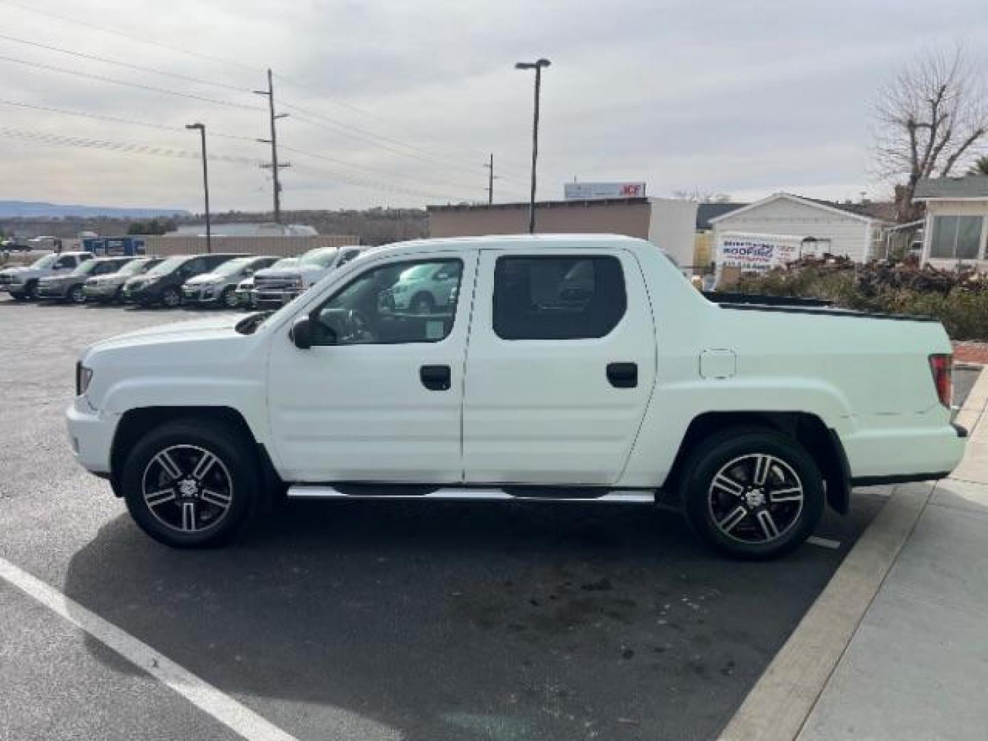 2014 White /Black Honda Ridgeline Sport (5FPYK1F75EB) with an 3.5L V6 SOHC 24V engine, 5-Speed Automatic transmission, located at 940 North Main Street, Cedar City, UT, 84720, (435) 628-0023, 37.692936, -113.061897 - We specialize in helping ALL people get the best financing available. No matter your credit score, good, bad or none we can get you an amazing rate. Had a bankruptcy, divorce, or repossessions? We give you the green light to get your credit back on the road. Low down and affordable payments that fit - Photo#3