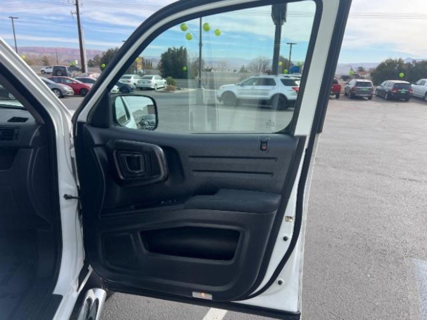 2014 White /Black Honda Ridgeline Sport (5FPYK1F75EB) with an 3.5L V6 SOHC 24V engine, 5-Speed Automatic transmission, located at 940 North Main Street, Cedar City, UT, 84720, (435) 628-0023, 37.692936, -113.061897 - We specialize in helping ALL people get the best financing available. No matter your credit score, good, bad or none we can get you an amazing rate. Had a bankruptcy, divorce, or repossessions? We give you the green light to get your credit back on the road. Low down and affordable payments that fit - Photo#27