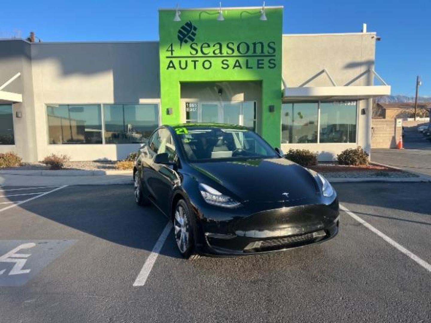 2021 Black /Black Tesla Model Y Long Range (5YJYGDEE5MF) with an Electric engine, 1 Speed-Automatic transmission, located at 1865 East Red Hills Pkwy, St. George, 84770, (435) 628-0023, 37.120850, -113.543640 - This 2021 Tesla Model Y Long Range is the perfect blend of speed, efficiency, and cutting-edge technology. With Dual Motor All-Wheel Drive, it accelerates from 0 to 60 mph in just 4.8 seconds while delivering an impressive 326-mile range on a single charge. Inside, enjoy a spacious, modern interior - Photo#0